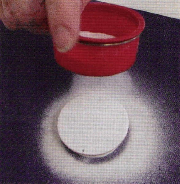 Fig 2. Coating backside with opaque white dry enamel by sifting.