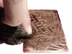 Clean the metal of liquid gold residue using steel wool.