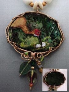 Crane Love. Basse taille enamel, gold foil, gold-fill wire, beads. Inset: Backside of Crane Love.