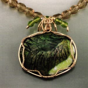 Holiday. Enamel on copper, gold-filled three-wire bezel, beads