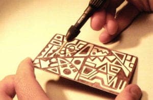 Finishing the design using the scribing tool.