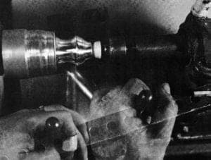 Spinning skills - Forming a necked piece using tool on either side of the fulcrum pin.