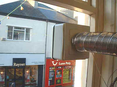 Window extraction fan and vent outlet in position.