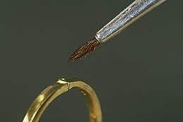 Figure 4.8. Fluxing the seam before tension soldering