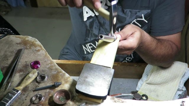 Student setting an Oval stone