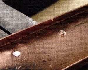 Fig 13. Inner side of brooch frame with conical drilled hole and a bit of rivet on right side and on the left, the finished rivet