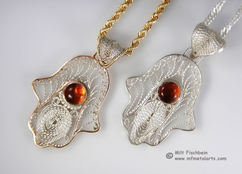 filigree pendants with orange stones